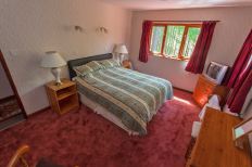 Leckmelm House holiday home double room with king size bed.