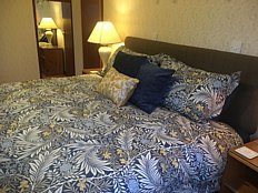 Leckmelm House holiday home double room with king size bed.